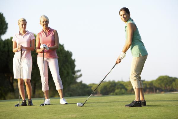 Women playing golf